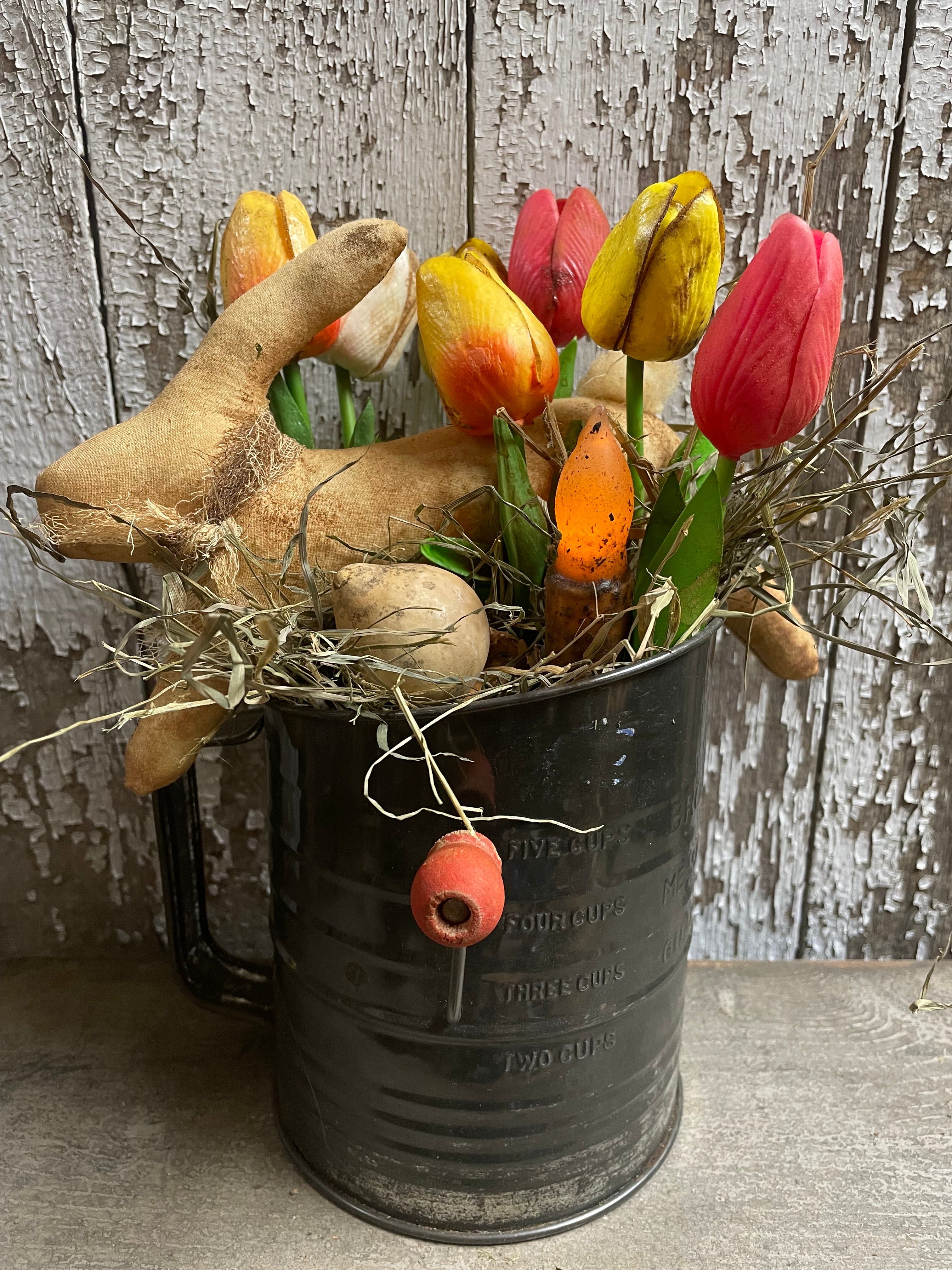 Primitive Bunny Egg Gourd And Tulips With Tapered Candle In Antique Sifter Gathering 12x7